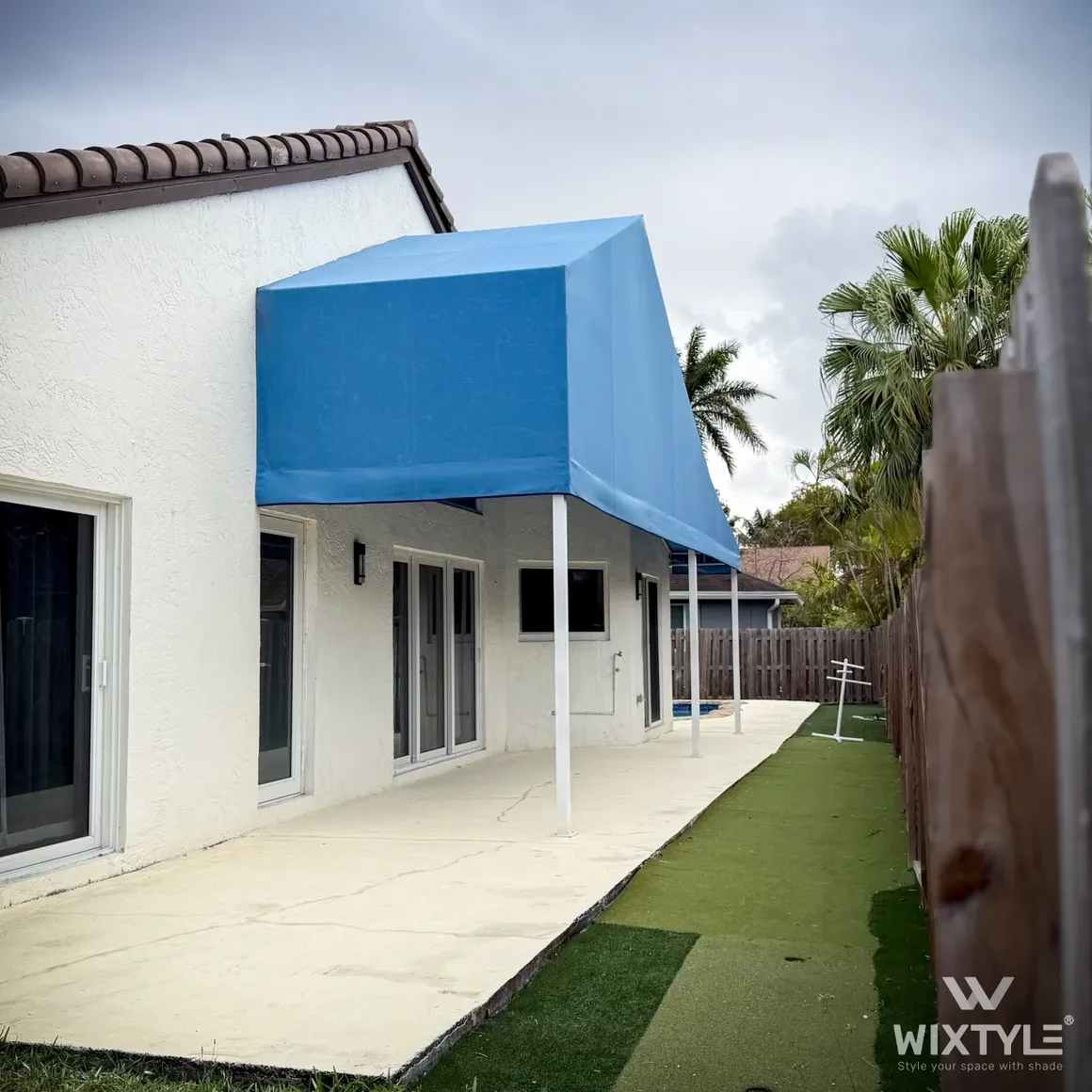 Blue fixed canopy on residential home — WIXTYLE